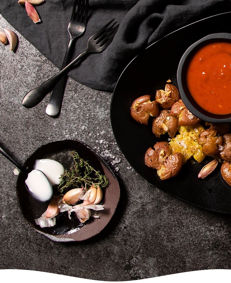 Smashed Garlic Potatoes Yogurt Harissa Topping